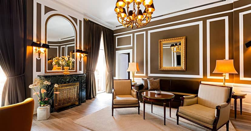 Luxury boardroom at Excelsior Hotel Ernst with fireplace for exclusive corporate meetings.