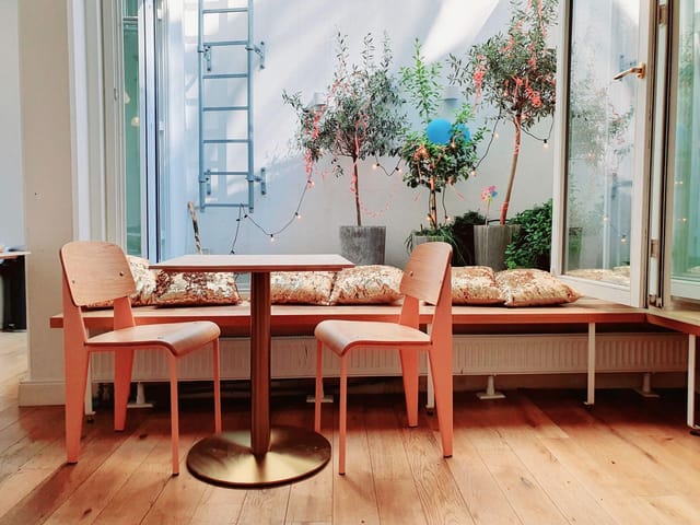 Biophilic breakout space at Maison Marsil for collaborative huddles and creative events.