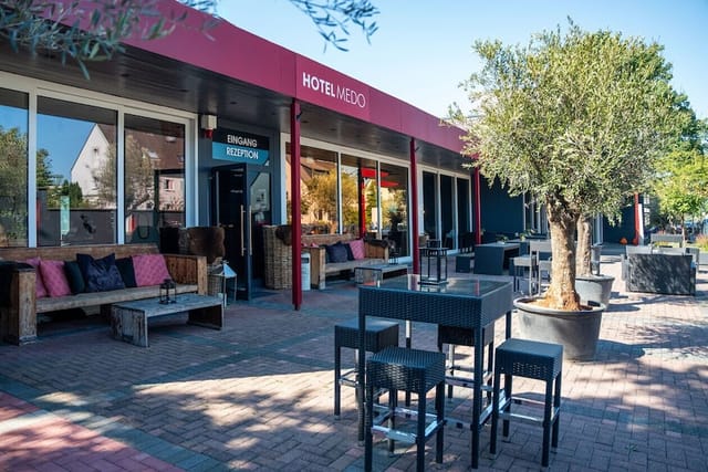 Hotel Medo outdoor networking space with casual seating for corporate events.