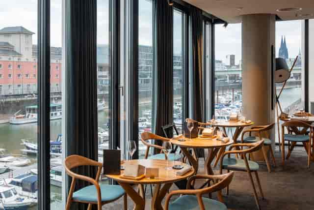 Ox & Klee high-end restaurant with harbor views for VIP hospitality and corporate networking.