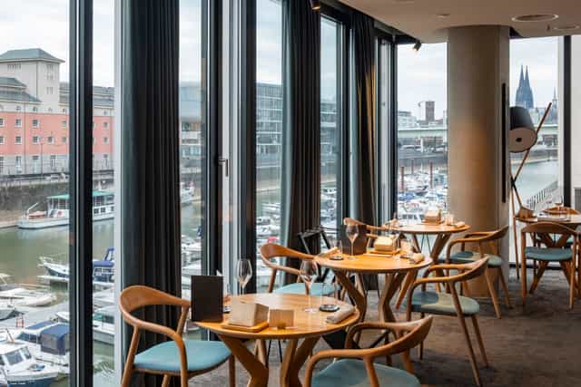 Ox & Klee high-end restaurant with harbor views for VIP hospitality and corporate networking.