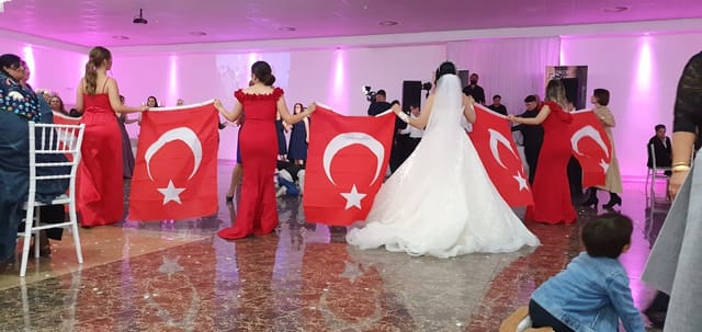 Wedding reception in ELIT EVENT SAAL I ballroom featuring cultural flag procession.