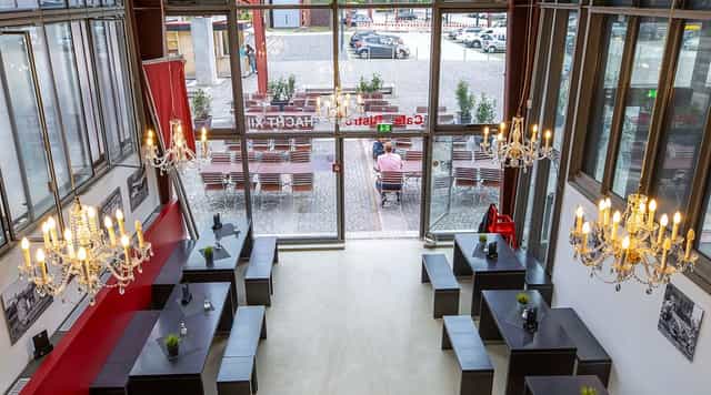 Bistro Schacht XII industrial event venue with crystal chandeliers for corporate or wedding hire.