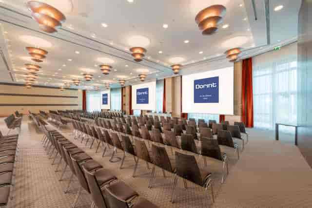 Radisson Blu theater-style conference room with dual screens for corporate events and presentations.