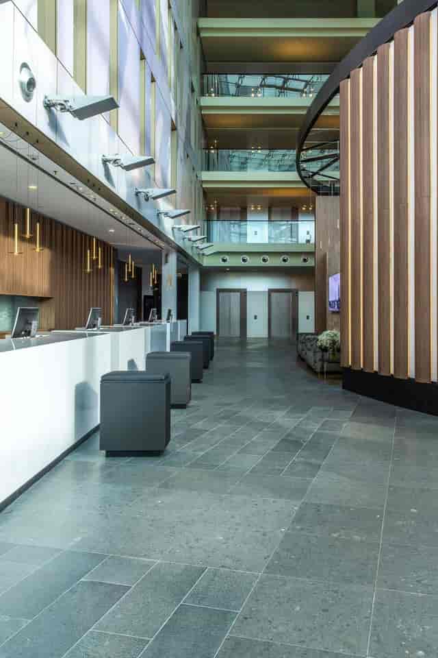Modern Radisson Blu hotel reception for large-scale event and conference check-ins.