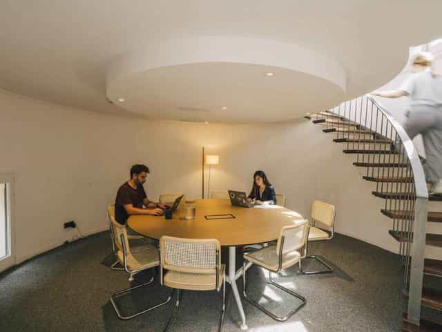 Circular breakout office space for workshops and collaborative meetings at Cloudworks.