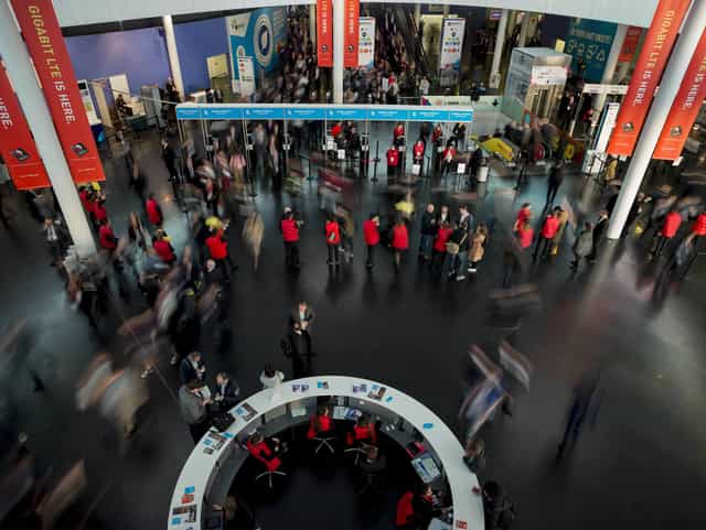 Event registration at Fira Barcelona Gran Via with security screening lanes for trade shows.