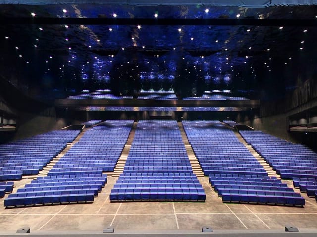 Sala Auditori Barcelona: tiered auditorium with atmospheric lighting for plenary sessions or galas.