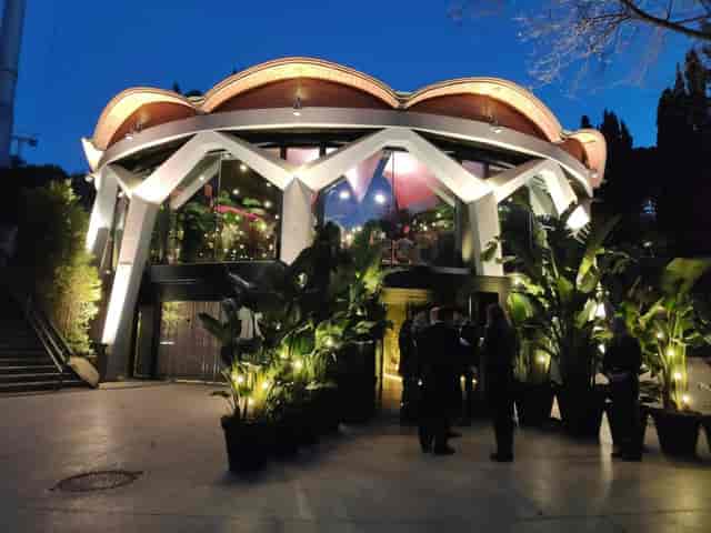 Circular R Higher Vidreres venue with dramatic lighting for high-end evening receptions and events.