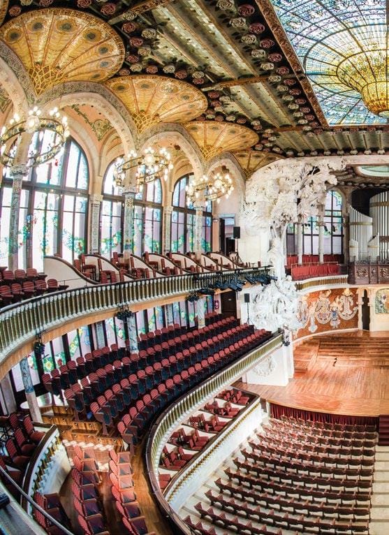 Foyer of Palau de la Música Catalana with intricate columns for music venue event architecture.