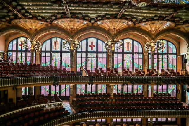 Art Nouveau auditorium at Palau de la Música Catalana for corporate plenary or cultural gala.