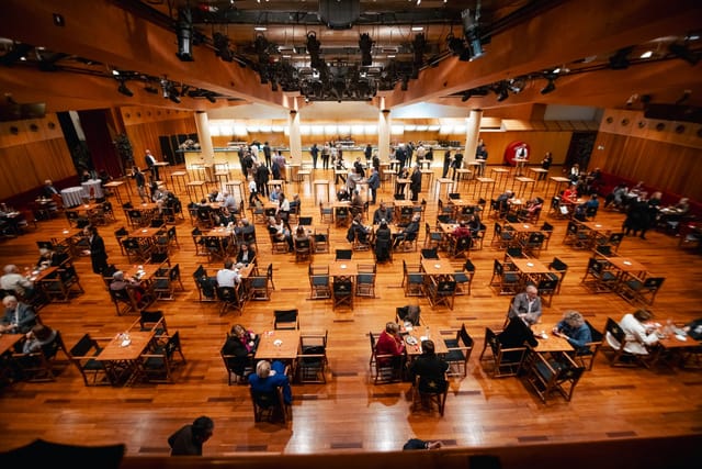 Networking reception in Gran Teatre del Liceu foyer with high ceilings for corporate events.