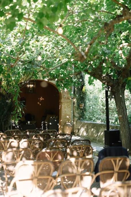 Rustic outdoor wedding ceremony at Villa Almanita garden with textured seating.