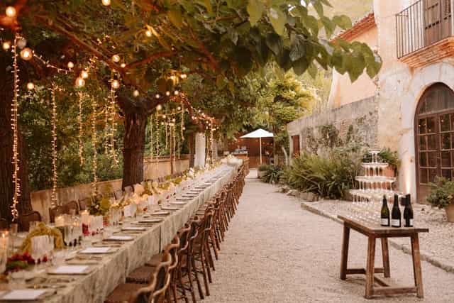 Luxury outdoor banquet setup at Villa Almanita with champagne tower for premium event venue.