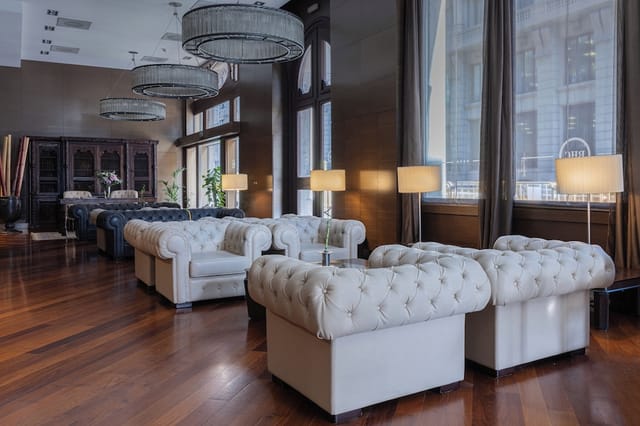 Hotel Colonial Barcelona meeting room with tufted seating for VIP networking and breakout sessions.