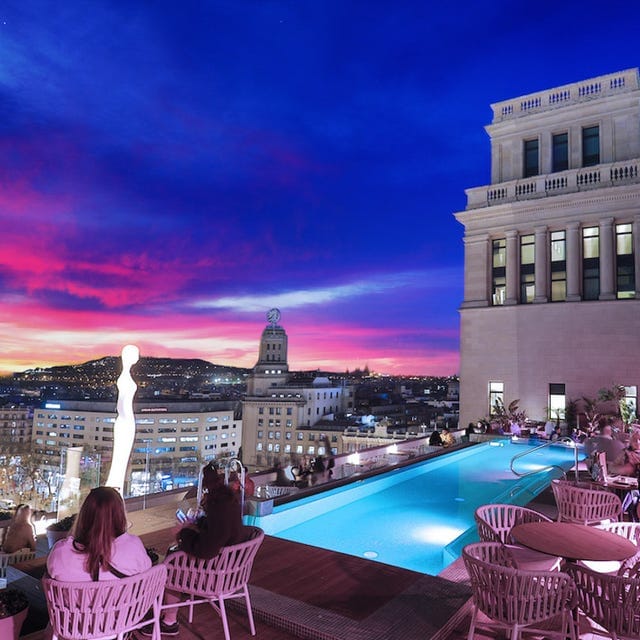 Luxury rooftop bar at sunset, perfect for VIP networking and premium cocktail events.