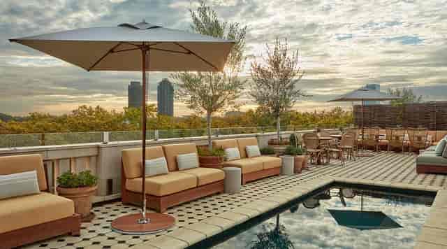 Rooftop venue at The Gallery Borneta with poolside lounge for upscale networking events.