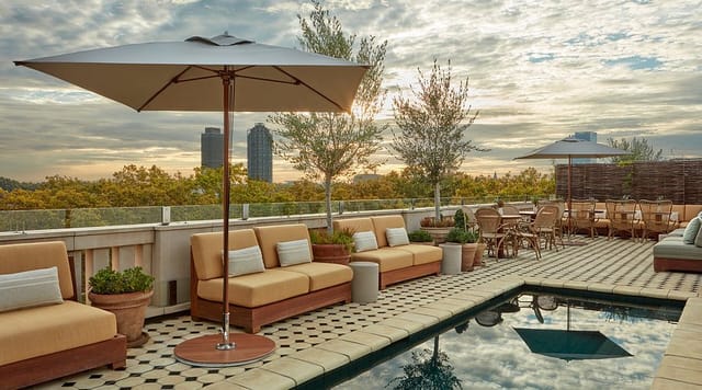 Rooftop venue at The Gallery Borneta with poolside lounge for upscale networking events.