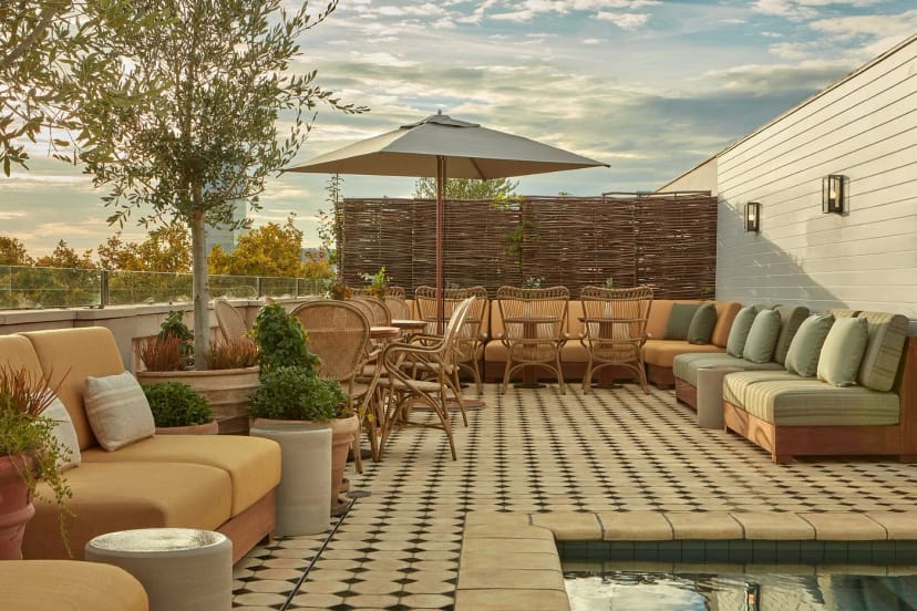 Rooftop bar in Borneta featuring lounge seating for networking events and corporate receptions.