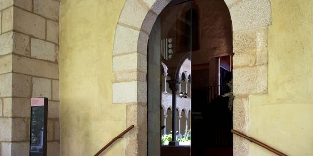 Historic Monestir de Pedralbes activities room entrance for exclusive gala and boutique conferences.