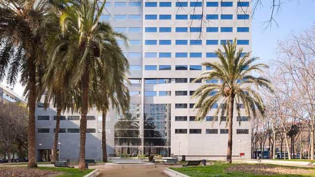 Modern Hilton Barcelona conference center with landscaped grounds for corporate events.