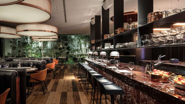 Atmospheric Sir Victor Hotel restaurant for luxury VIP dinners and corporate networking events.