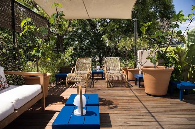 Hotel Neri rooftop terrace, verdant lounge, ideal for VIP events and corporate networking.
