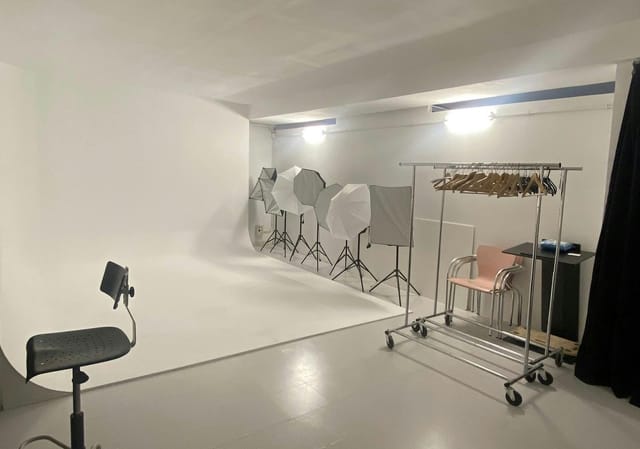 Minimalist studio space for corporate event headshots and product photography.