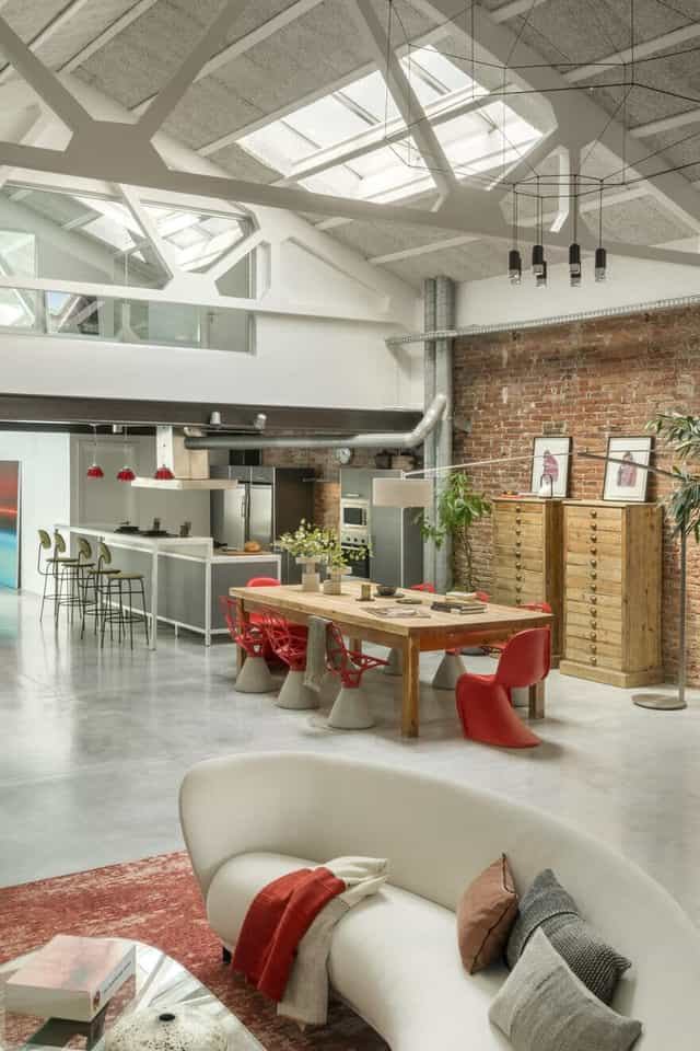 Industrial-chic photography studio and event space with open kitchen for creative workshops.