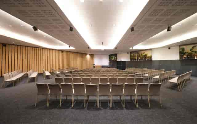 Modern auditorium at Hotel SB Icaria with curved walls for professional conferences and events.