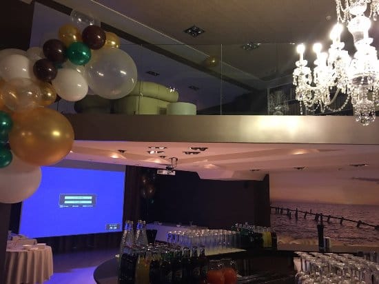 Sala Vanity Room event setup with AV projector screen for corporate meetings and conferences.