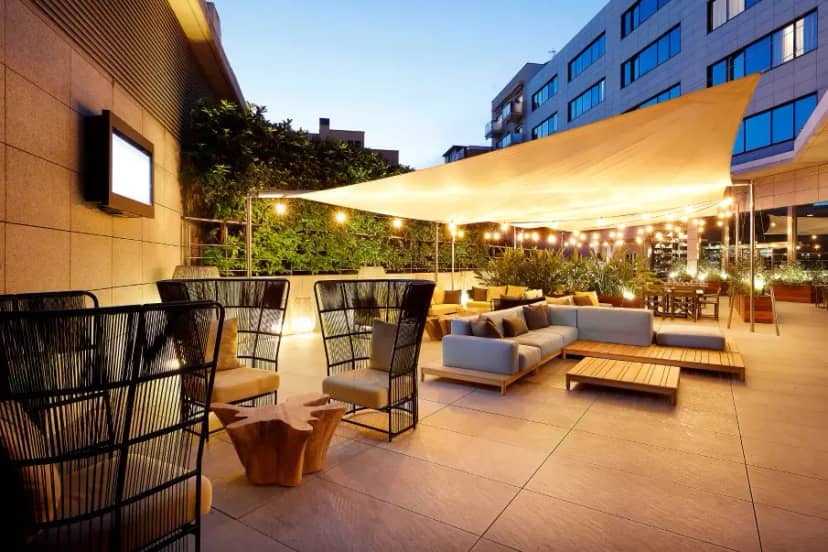 Rooftop event space at Hotel SB Icaria with lounge seating for corporate cocktail networking.