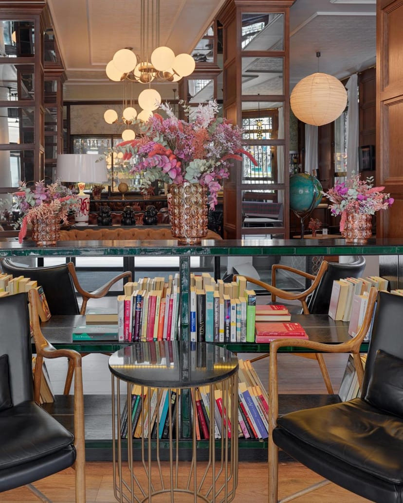 Library Restaurant lounge with bookshelf decor for intimate networking and corporate breakout events.