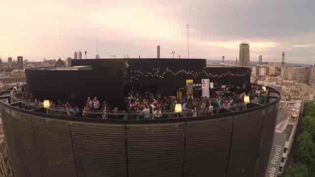 Rooftop networking reception at Hotel Barceló Raval with panoramic Barcelona city views.