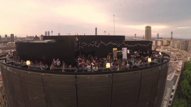 Rooftop networking reception at Hotel Barceló Raval with panoramic Barcelona city views.