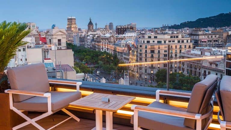 Rooftop bar at Majestic Hotel Barcelona, elegant skyline venue for networking and VIP receptions.