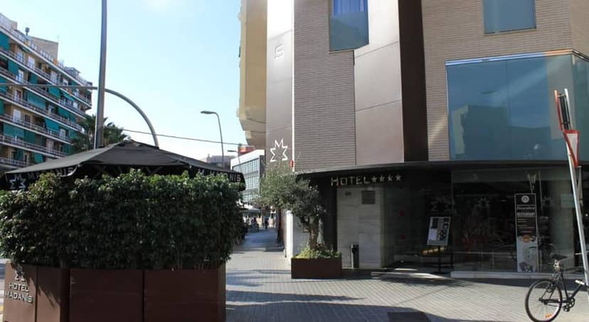 Hotel Madanis facade: 4-star venue for intimate urban event planning and professional gatherings.