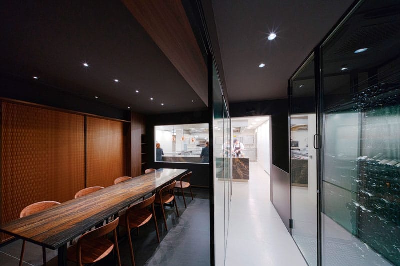 Semi-private dining room with glass partitions for VIP boardroom meetings and corporate dinners.