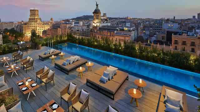 Luxury rooftop terrace with infinity pool for VIP receptions and corporate networking events.