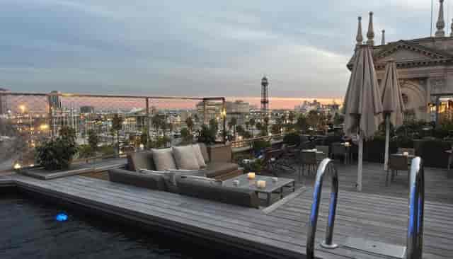 Rooftop cocktail reception at Duquesa de Cardona hotel with panoramic views for luxury VIP events.