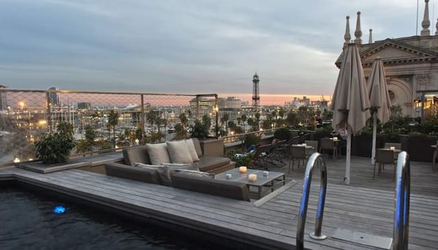 Rooftop cocktail reception at Duquesa de Cardona hotel with panoramic views for luxury VIP events.