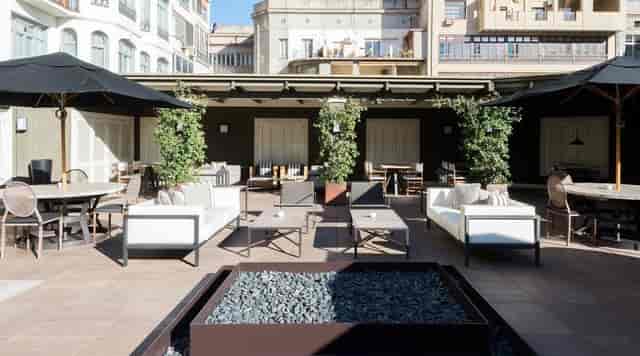 Hotel Granvia library lounge with fire pits for outdoor networking and corporate event receptions.