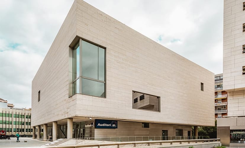 Modern, minimalist Auditori L'illa exterior for corporate conferences and formal presentations.