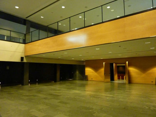 Esade Forum Amphitheater Foyer, industrial event space for corporate networking and registration.