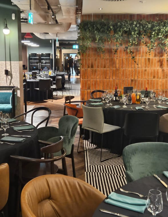 Banquet setup in Royal Tulip Warsaw Centre with eclectic seating for luxury events.