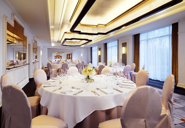 Upscale Salon Chopin banquet room with formal tables for corporate dinners and social galas.