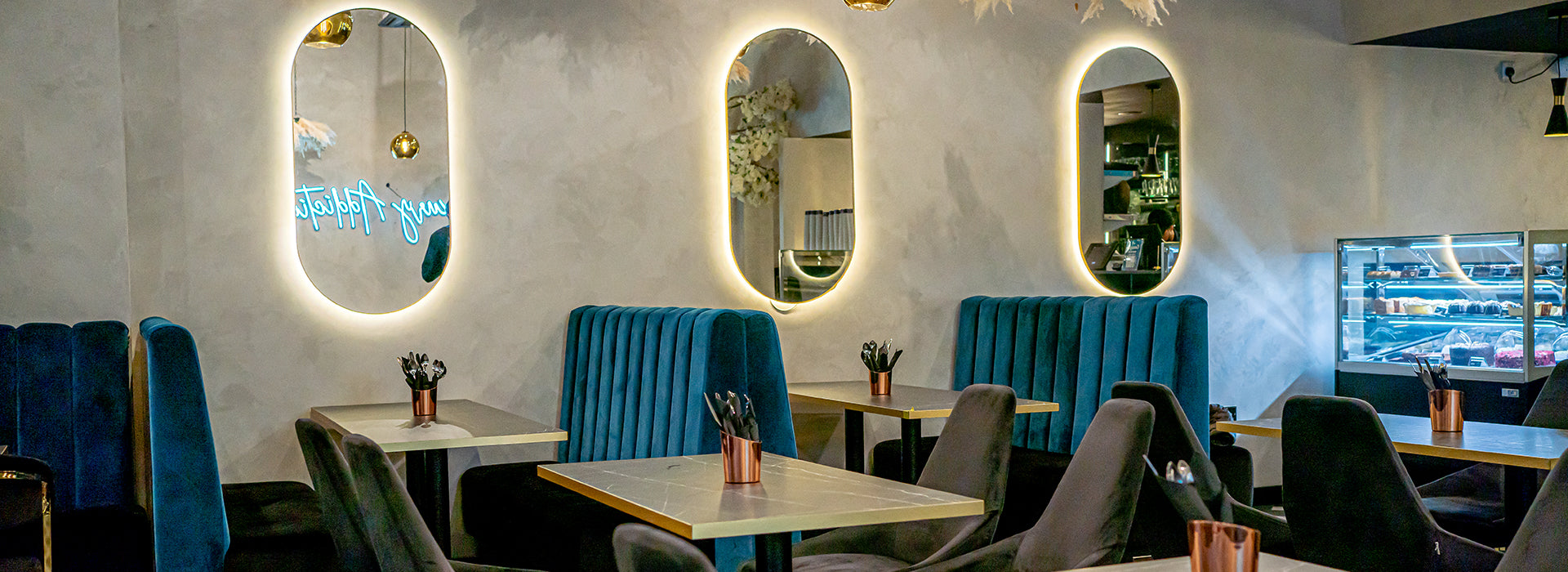 Luxury dessert shop with velvet booths for high-end networking and corporate events. - Banner