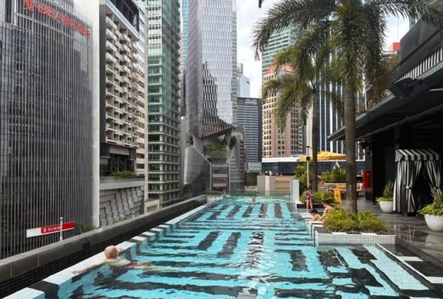 Rooftop pool at QT Singapore for upscale events and corporate retreats.
