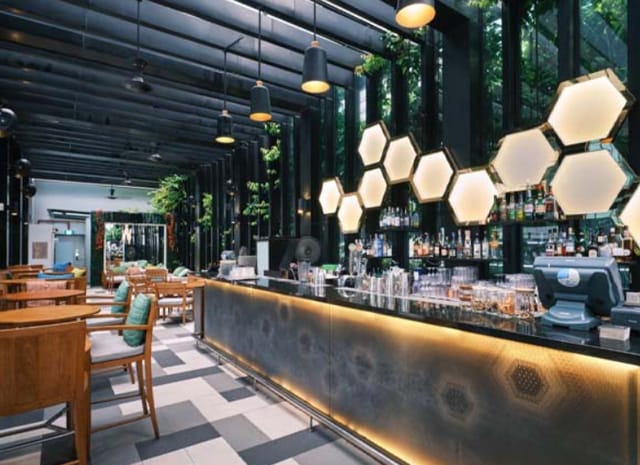 Stylish Rooftop Bar in QT Singapore with honeycomb lighting, ideal for upscale events.