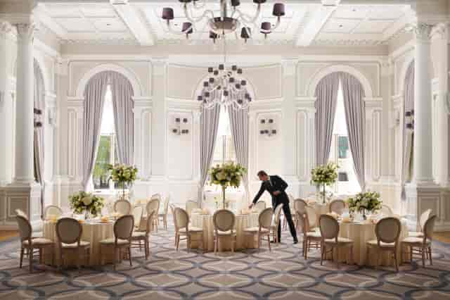 Luxury ballroom at Corinthia London with elegant floral decor for corporate galas and weddings.